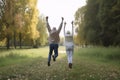 Happy senior couple jumping in park. Generative AI Royalty Free Stock Photo