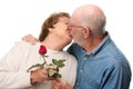 Happy Senior Couple Kissing with Red Rose Royalty Free Stock Photo