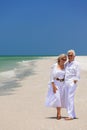 Happy Senior Couple Laughing Embracing on a Tropical Beach Royalty Free Stock Photo