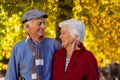 Happy senior couple looking at each other in park during autumn Royalty Free Stock Photo
