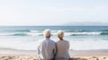 Happy senior couple looking enjoying beach sunset landscape together, summer vacation at sea coast Royalty Free Stock Photo