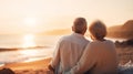 Happy senior couple looking enjoying beach sunset landscape together, summer vacation at sea coast Royalty Free Stock Photo