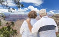 Happy Senior Couple Looking Out Over The Grand Canyon Royalty Free Stock Photo