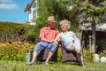 Happy senior couple in love relaxing together in the garden in summer Royalty Free Stock Photo