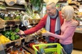 Happy senior couple making shopping at supermarket Royalty Free Stock Photo