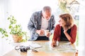 Senior couple with map at home, making plans. Royalty Free Stock Photo