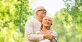 Happy senior couple over green natural background Royalty Free Stock Photo