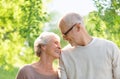 Happy senior couple over green natural background Royalty Free Stock Photo