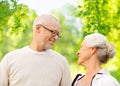 Happy senior couple over green natural background Royalty Free Stock Photo