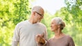 Happy senior couple over green natural background Royalty Free Stock Photo