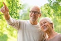 Happy senior couple over green natural background Royalty Free Stock Photo