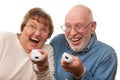 Happy Senior Couple Play Video Game with Remotes Royalty Free Stock Photo