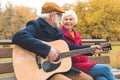 happy senior couple playing on acoustic guitar Royalty Free Stock Photo