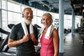 Happy senior couple posing in gym after working out Royalty Free Stock Photo