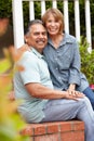 Happy senior couple relaxing in garden Royalty Free Stock Photo