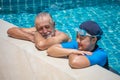 Happy Senior Couple Relaxing In Swimming Pool Together. having fun . retirement,workout,fitness,sport,exercise Royalty Free Stock Photo