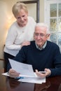 Happy Senior Couple Reviewing Domestic Finances Together Royalty Free Stock Photo