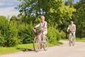 Happy senior couple riding bicycles at summer park Royalty Free Stock Photo