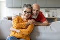 Happy Senior Couple. Romantic Elderly Man And Woman Hugging At Home Royalty Free Stock Photo