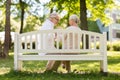 Happy senior couple sitting on bench at park Royalty Free Stock Photo