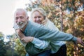 Happy senior couple smiling outdoors in nature Royalty Free Stock Photo