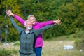 Happy senior couple smiling outdoors in nature. Grandparents, autumn. Royalty Free Stock Photo