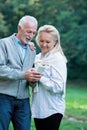 Happy senior couple smiling outdoors in nature Royalty Free Stock Photo