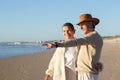 Happy senior couple standing at the beach Royalty Free Stock Photo