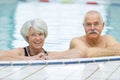 happy senior couple swimming in pool Royalty Free Stock Photo