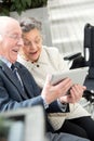 happy senior couple with tablet computer Royalty Free Stock Photo
