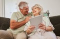 Happy senior couple, tablet and sofa to download news app, reading social media post and ebook. Elderly man, woman and Royalty Free Stock Photo