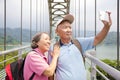 Happy senior couple taking picture with smart phone selfie Royalty Free Stock Photo