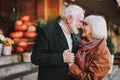 Happy senior couple touching noses on the street Royalty Free Stock Photo