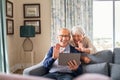 Happy senior couple doing video call at home Royalty Free Stock Photo