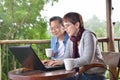 Happy senior couple using laptop computer at home Royalty Free Stock Photo