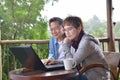 Happy senior couple using laptop computer at home Royalty Free Stock Photo