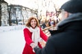 Senior couple on a walk in a city in winter. Royalty Free Stock Photo