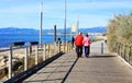 Happy senior couple walking along the coast the mediteranea sea Royalty Free Stock Photo