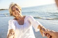 Happy Senior Couple Walking Holding Hands Tropical Beach Royalty Free Stock Photo