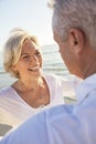 Happy Senior Couple Walking Holding Hands Tropical Beach Royalty Free Stock Photo