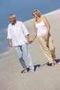 Happy Senior Couple Walking Holding Hands Tropical Beach Royalty Free Stock Photo