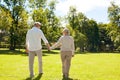 Happy senior couple walking at summer city park Royalty Free Stock Photo