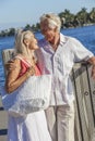 Happy Senior Couple Walking Tropical Sea or River Royalty Free Stock Photo