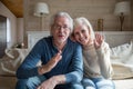 Happy senior couple having video call talking from home Royalty Free Stock Photo