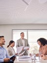 Happy senior executive leading business team meeting in office board room. Royalty Free Stock Photo