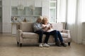 Happy senior family couple enjoying online, Internet communication at home Royalty Free Stock Photo