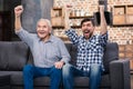 Happy senior father and his son resting at home Royalty Free Stock Photo