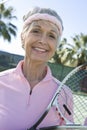 Happy Senior Female Tennis Player Royalty Free Stock Photo