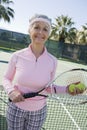 Happy Senior Female Tennis Player Royalty Free Stock Photo