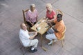 Happy Senior Friends Playing Cards Royalty Free Stock Photo